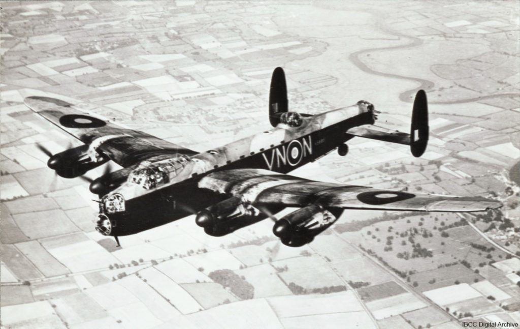 Air-to-air photograph of a Lancaster with the Squadron Code 'VN-N' in flight over Sutton on Trent