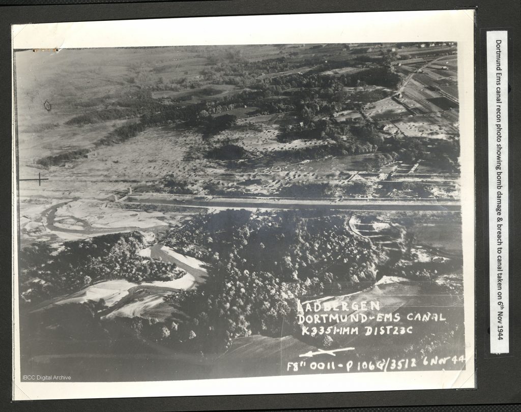 Oblique aerial photograph annotated 'Ladbergen Dortmund Ems Canal K3351-1MM Dist 23 C F8" 0011 - P106G/3512 6 Nov 44'. Captioned 'Dortmund Ems Canal recon photo showing bomb damage & breach to canal taken on 6th Nov 1944'.